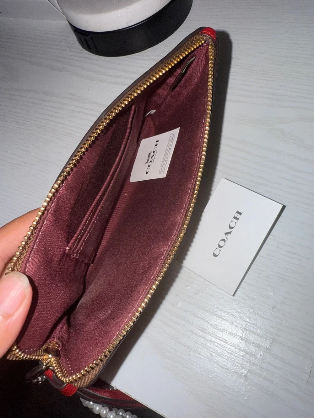 Coach Brown Signature Wristlet with Pearl & Cherry Charm (charm not included)
